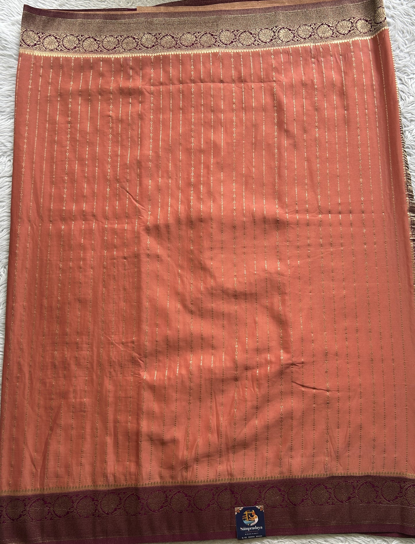 Semi Georgette Saree Peach Colored Elegantly Paired with a Zari Border. - Sampradaya Designer Studio