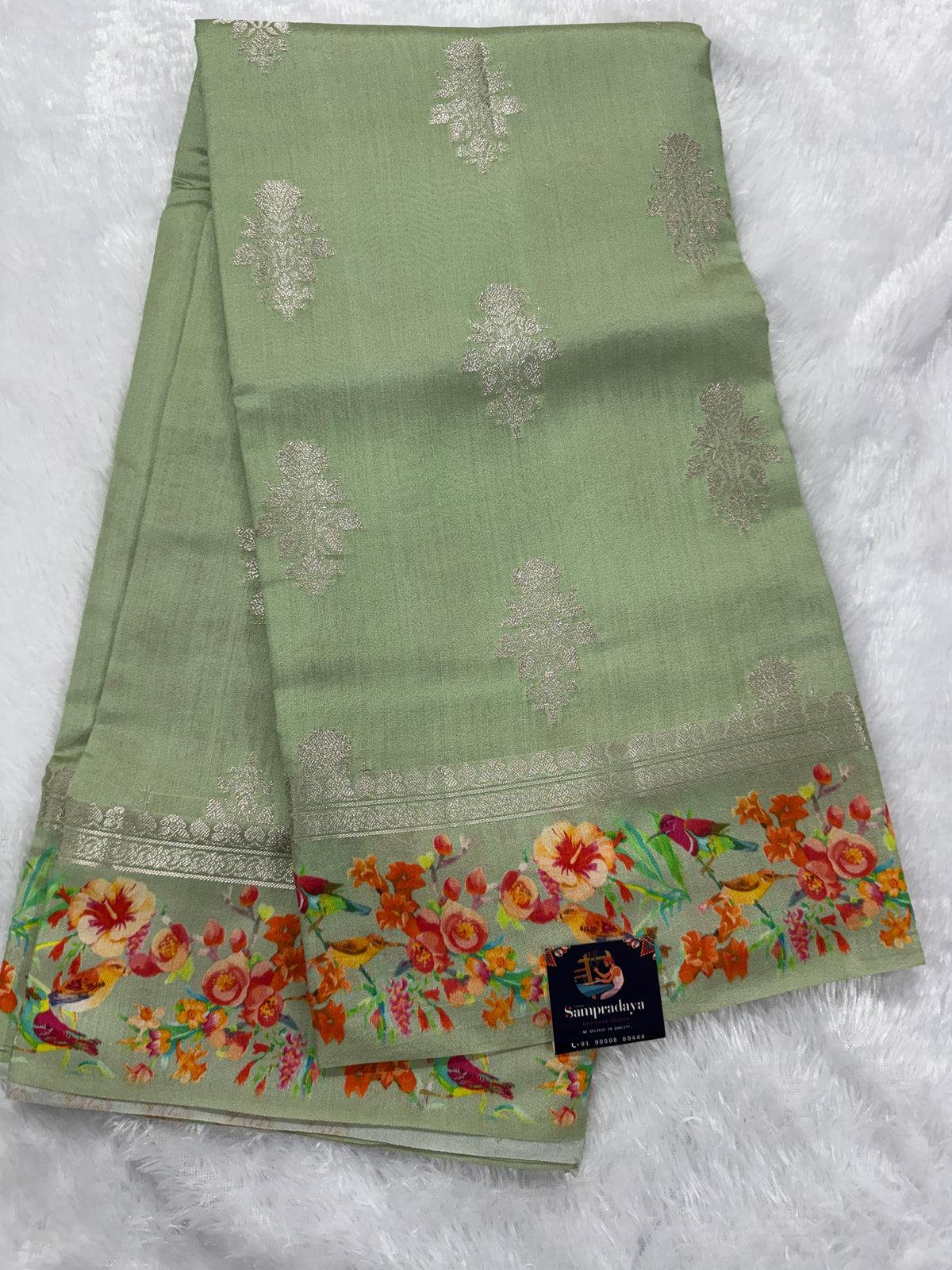Pure Chiniya Silk Saree Sea Green Colored Elegantly Paired with a Gold Zari Border.