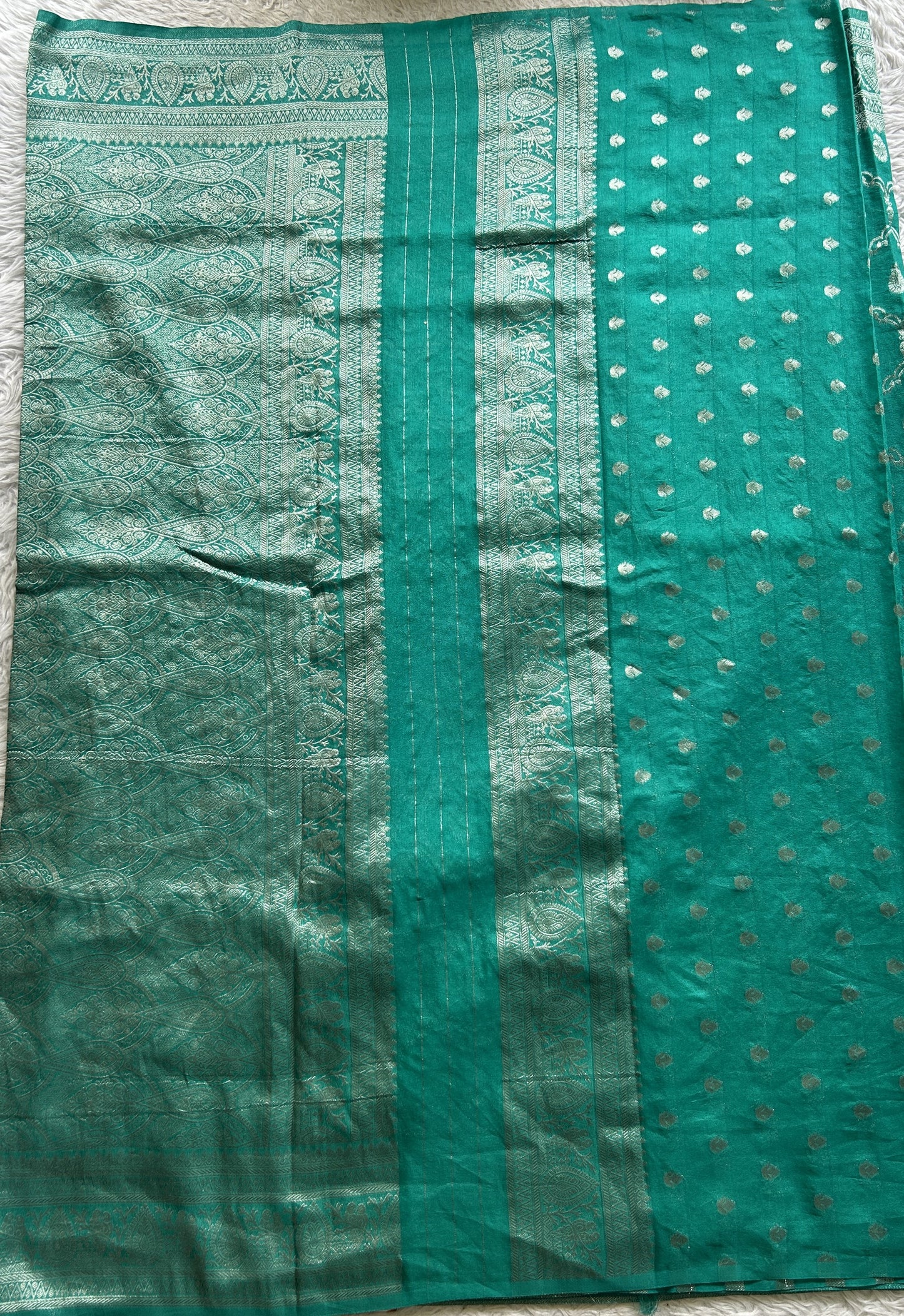Semi Georgette Saree Sea Green Colored Elegantly Paired with a Zari Border. - Sampradaya Designer Studio