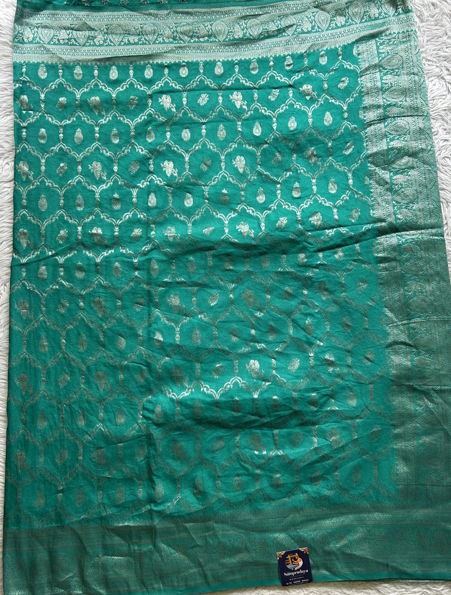Semi Georgette Saree Sea Green Colored Elegantly Paired with a Zari Border. - Sampradaya Designer Studio