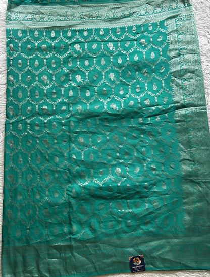 Semi Georgette Saree Sea Green Colored Elegantly Paired with a Zari Border. - Sampradaya Designer Studio