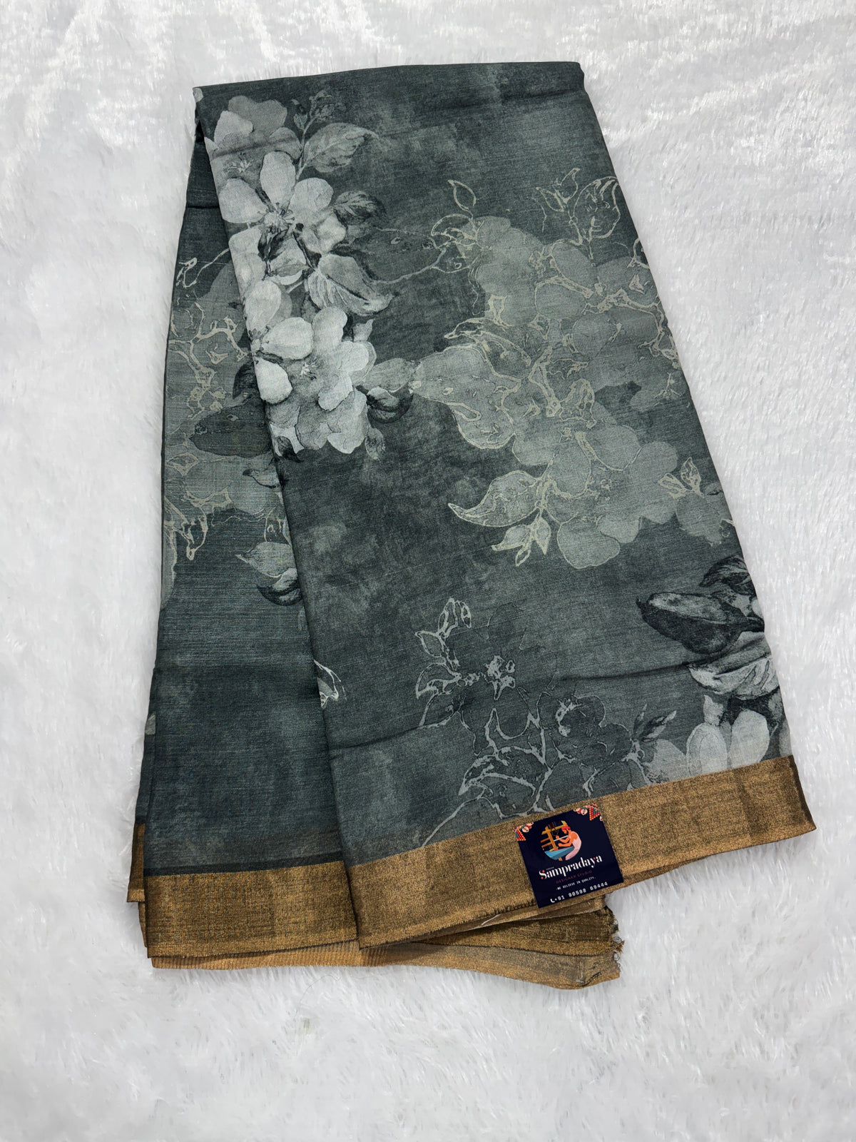 Pure Chiniya Silk Saree Gray Colored Elegantly Paired with a Gold Zari Border.
