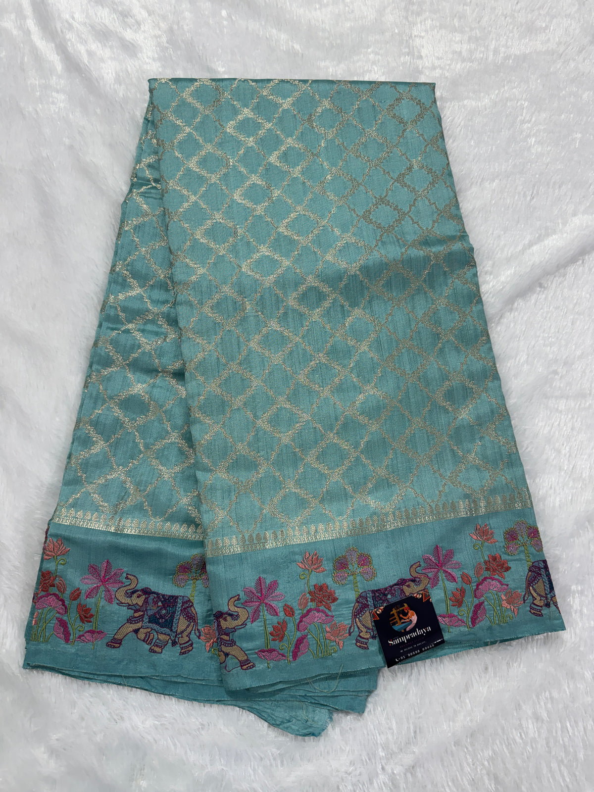 Pure Chiniya Silk Saree Sea Green Colored Elegantly Paired with a Gold Zari Border