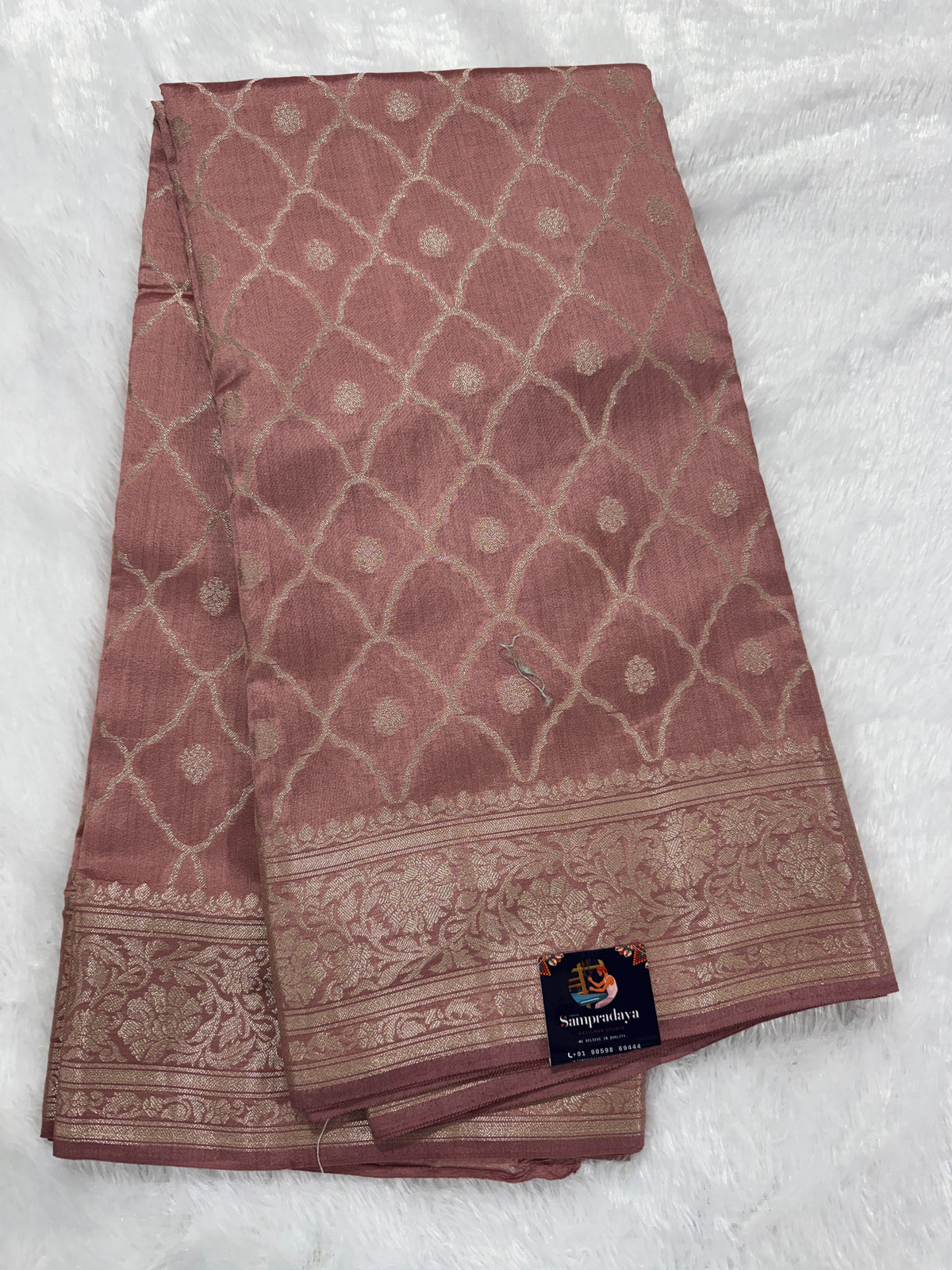 Pure Chiniya Silk Saree Peach Colored Elegantly Paired with a Gold Zari Border