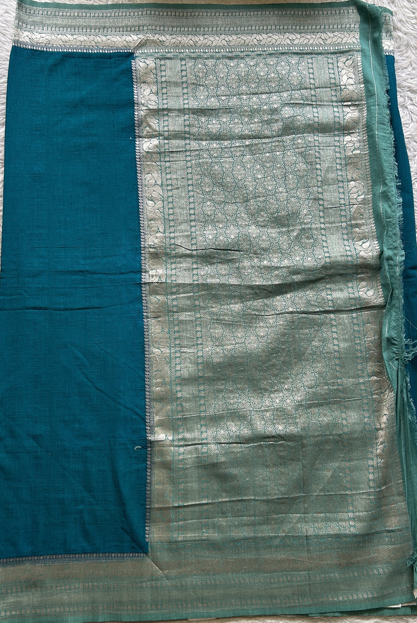Semi Georgette Saree Sea Blue Colored Elegantly Paired with a Zari Border. - Sampradaya Designer Studio