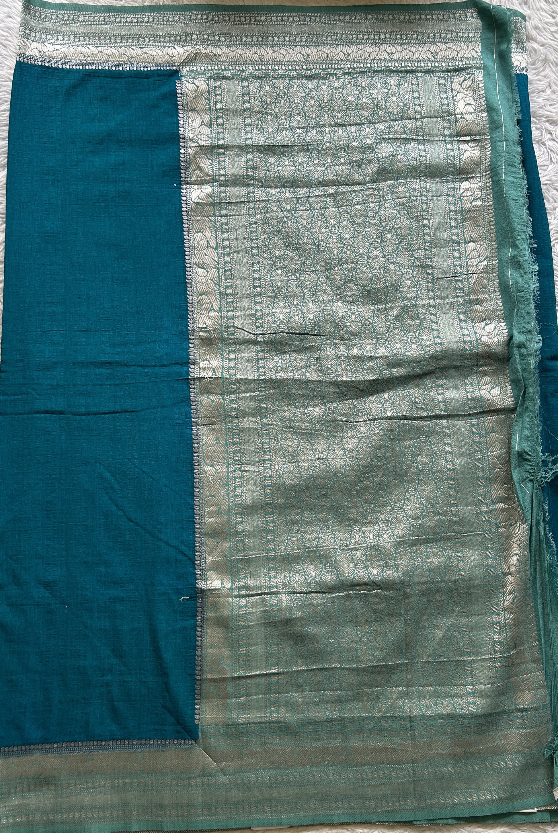 Semi Georgette Saree Sea Blue Colored Elegantly Paired with a Zari Border. - Sampradaya Designer Studio