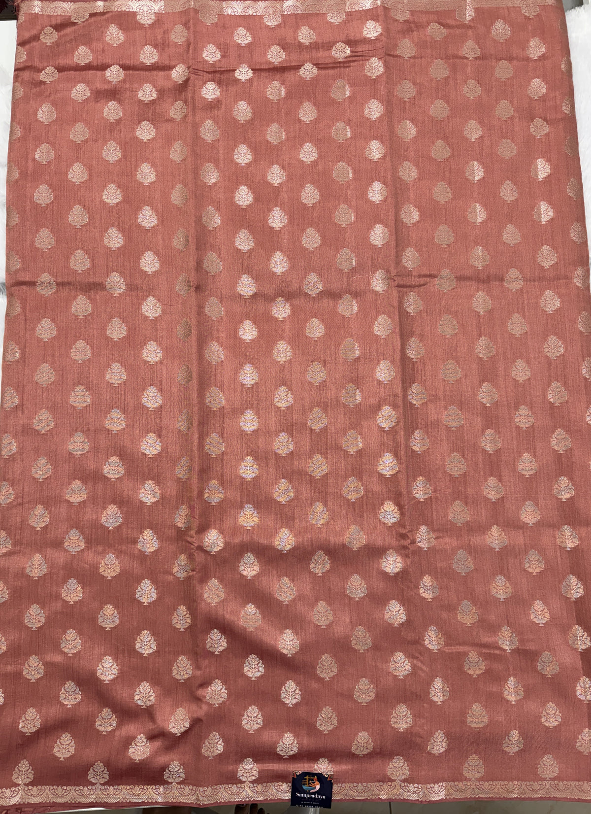 Pure Chiniya Silk Saree Peach Colored Elegantly Paired with a Gold Zari Border