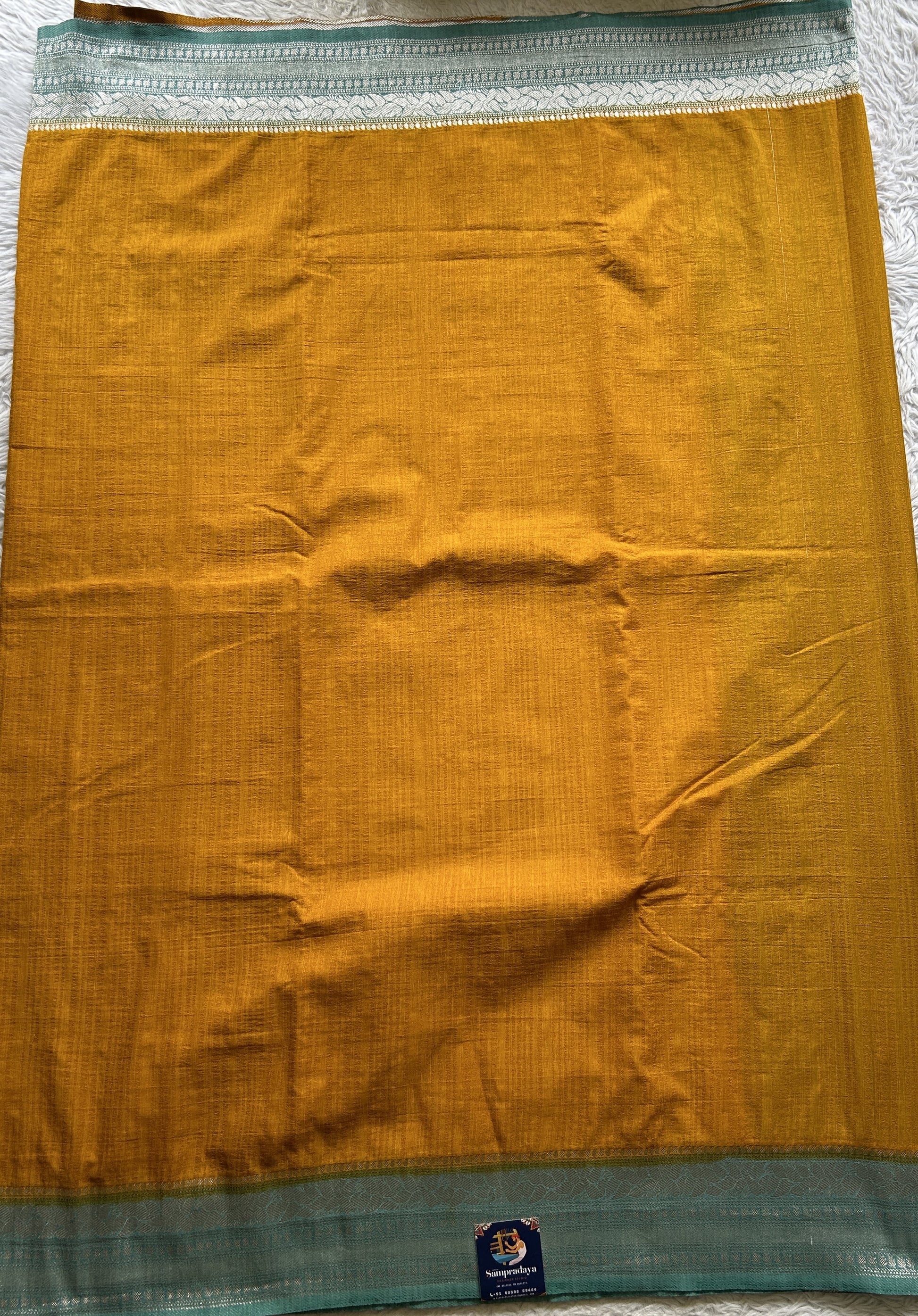 Semi Georgette Saree Yellow Colored Elegantly Paired with a Zari Border. - Sampradaya Designer Studio