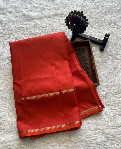 Mangalagiri Plain Pattu Saree Red Orange colored complemented with a mangalagiri Gap Border - Sampradaya Designer Studio