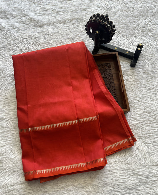 Mangalagiri Plain Pattu Saree Red Orange colored complemented with a mangalagiri Gap Border - Sampradaya Designer Studio