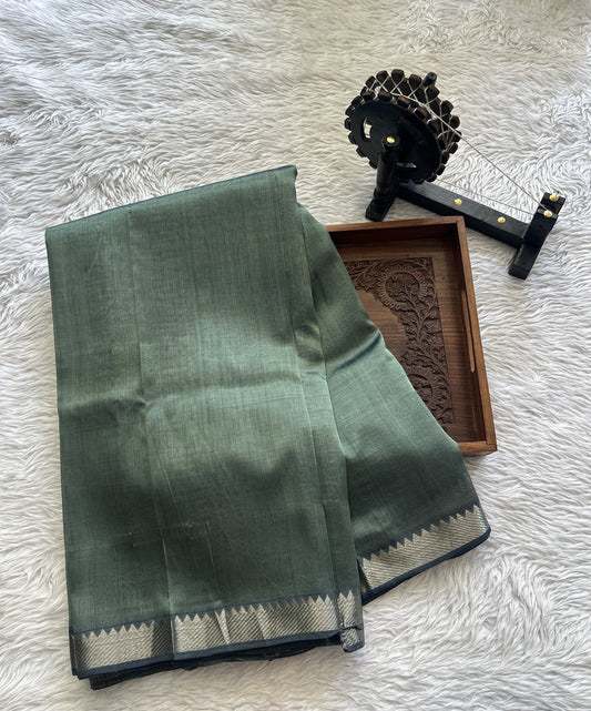 Mangalagiri Plain Pattu Saree Peacock Green colored complemented with a Zari Border - Sampradaya Designer Studio