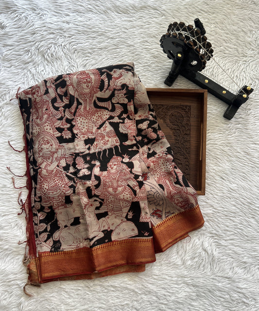 Mangalagiri Pen Kalamkari Saree Black colored complemented with a Red Colored Zari border - Sampradaya Designer Studio