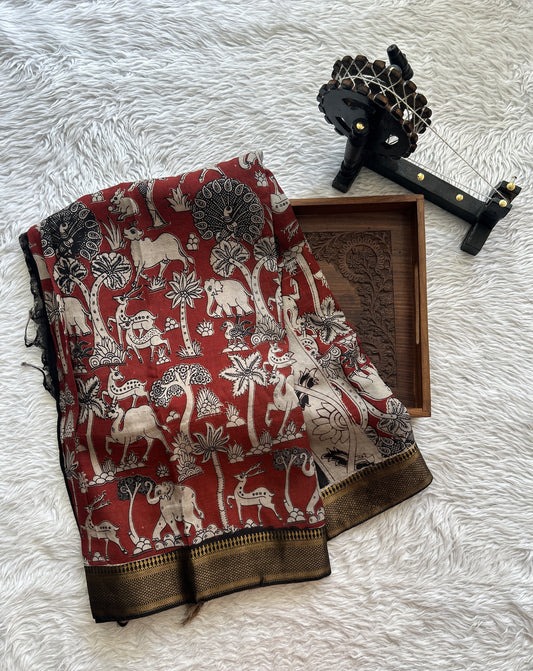 Mangalagiri Pen Kalamkari Saree Maroon colored complemented with a Black Colored Zari border - Sampradaya Designer Studio