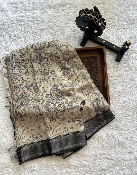 Mangalagiri Pen Kalamkari Saree Beige colored complemented with a Black Colored Zari border - Sampradaya Designer Studio