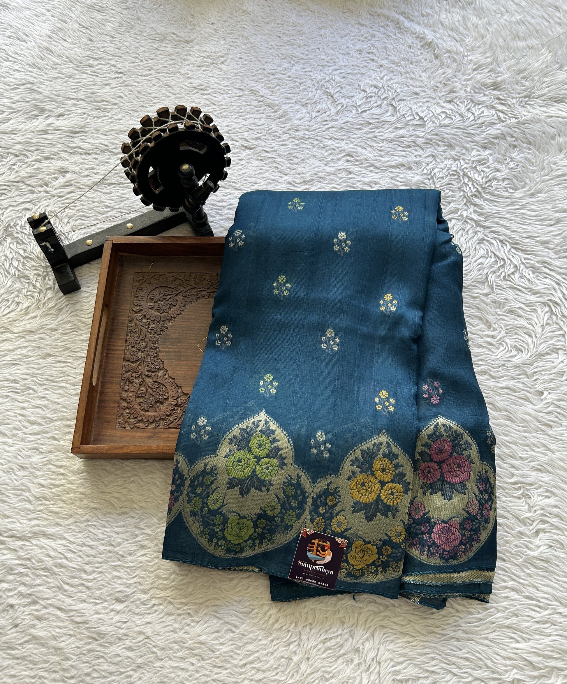 Banarasi Tussar Georgette Saree Peacock Blue Colored Complemented with a Minakari border. - Sampradaya Designer Studio
