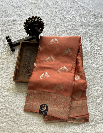 Banarasi Georgette Saree Peach Colored Complemented with a Zari border. - Sampradaya Designer Studio