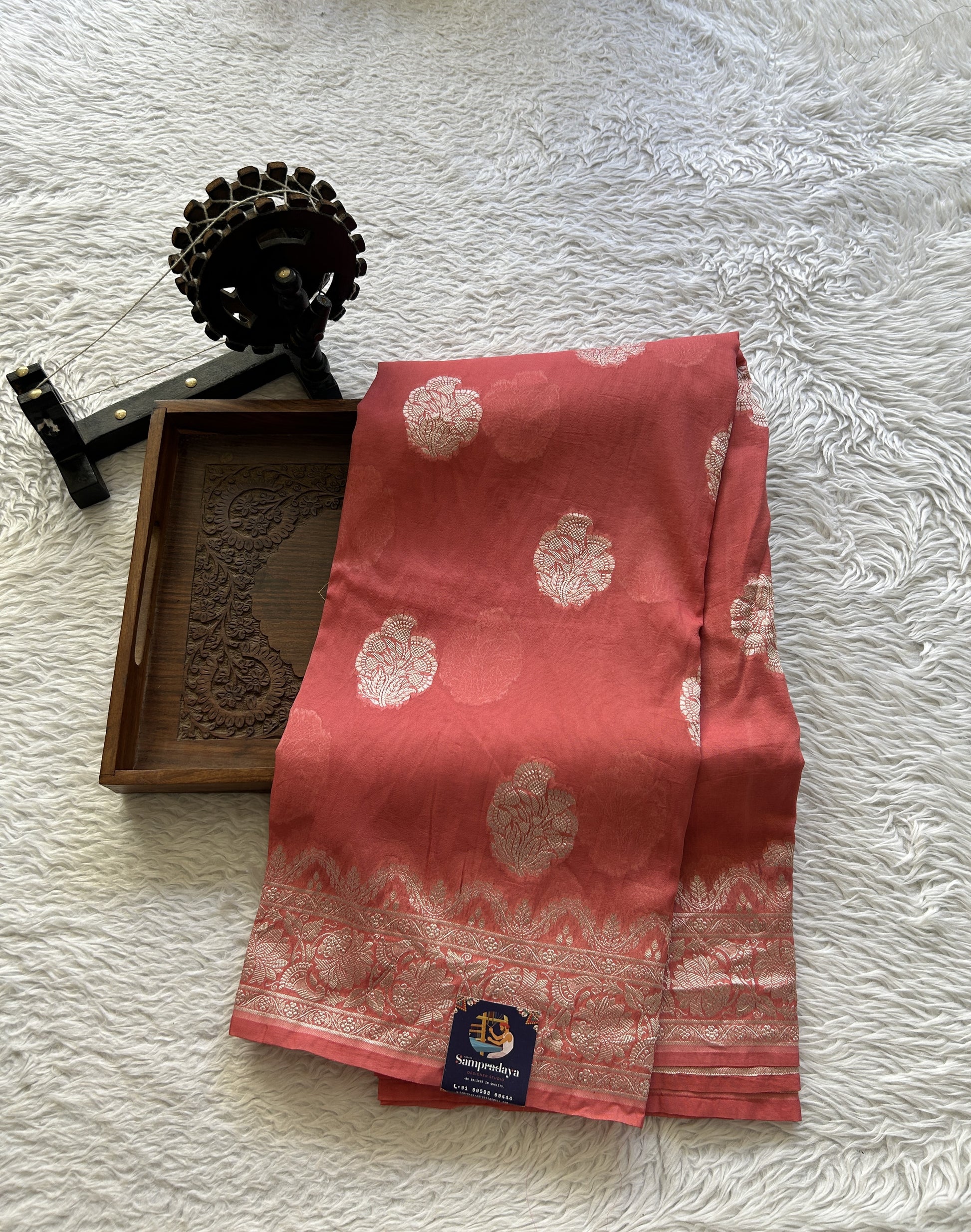 Banarasi Georgette Saree Peach Colored Complemented with a Zari border. - Sampradaya Designer Studio