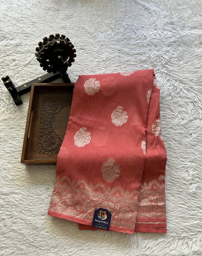 Banarasi Georgette Saree Peach Colored Complemented with a Zari border. - Sampradaya Designer Studio