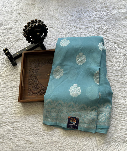 Banarasi Georgette Saree Light Sea Blue Colored Complemented with a Zari border. - Sampradaya Designer Studio