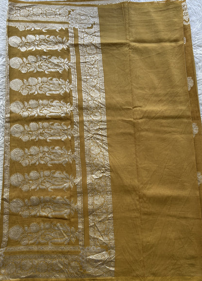 Banarasi Georgette Saree Mustard Colored Complemented with a Zari border. - Sampradaya Designer Studio
