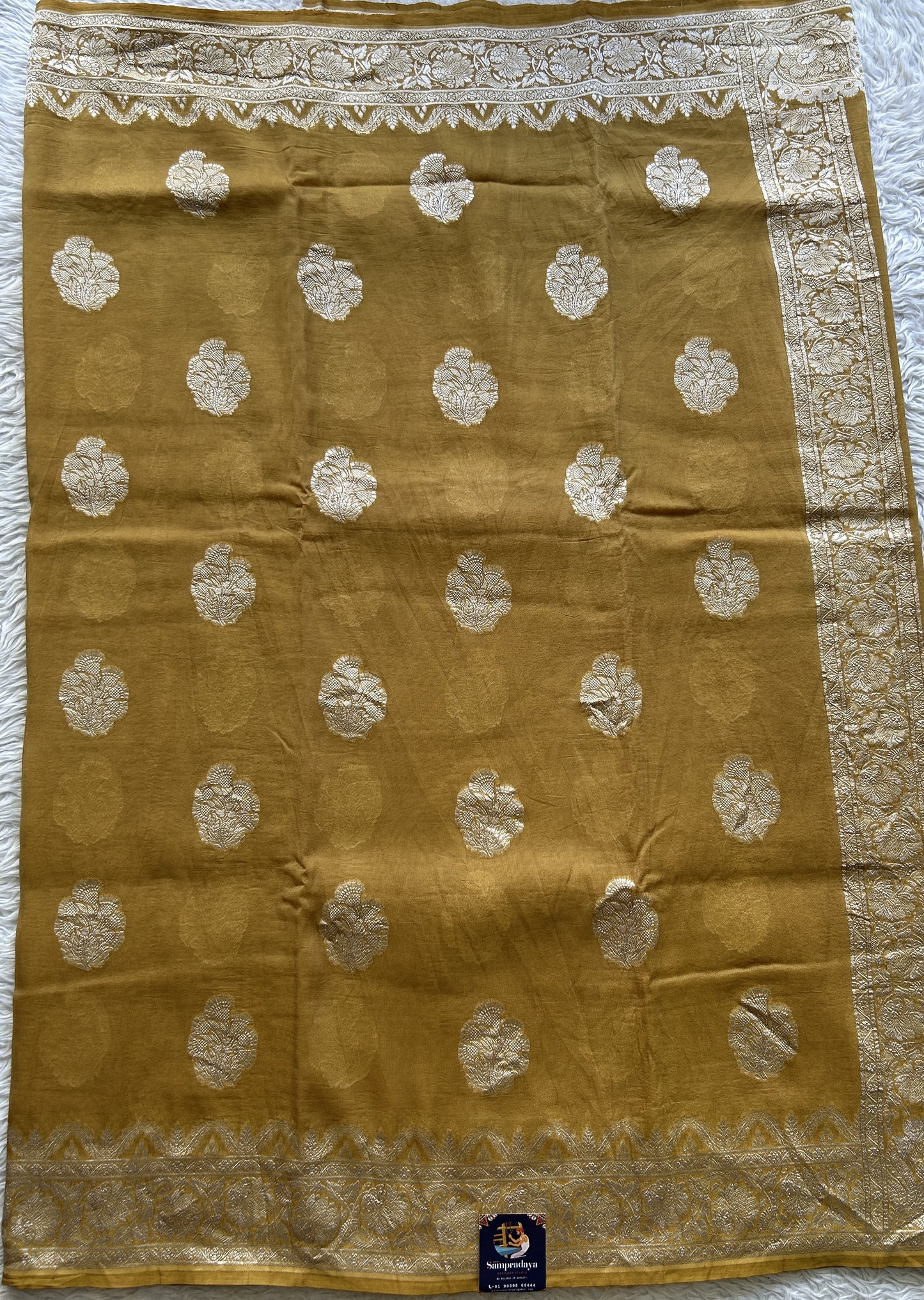 Banarasi Georgette Saree Mustard Colored Complemented with a Zari border. - Sampradaya Designer Studio