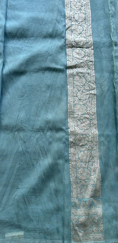 Banarasi Georgette Saree Light Sea Blue Colored Complemented with a Zari border. - Sampradaya Designer Studio