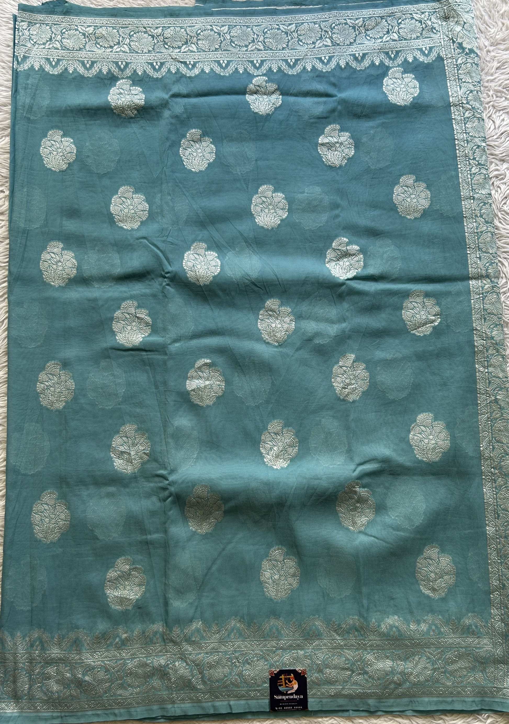 Banarasi Georgette Saree Light Sea Blue Colored Complemented with a Zari border. - Sampradaya Designer Studio