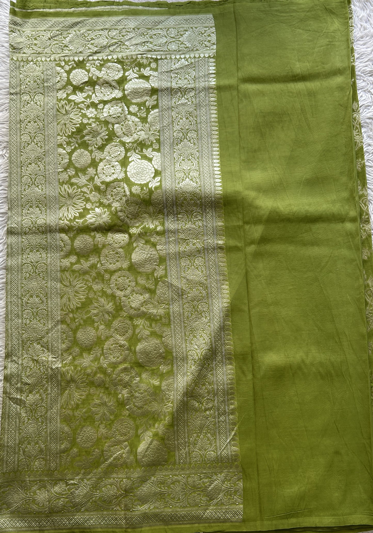Banarasi Georgette Saree Parrot Green Colored Complemented with a Zari border. - Sampradaya Designer Studio