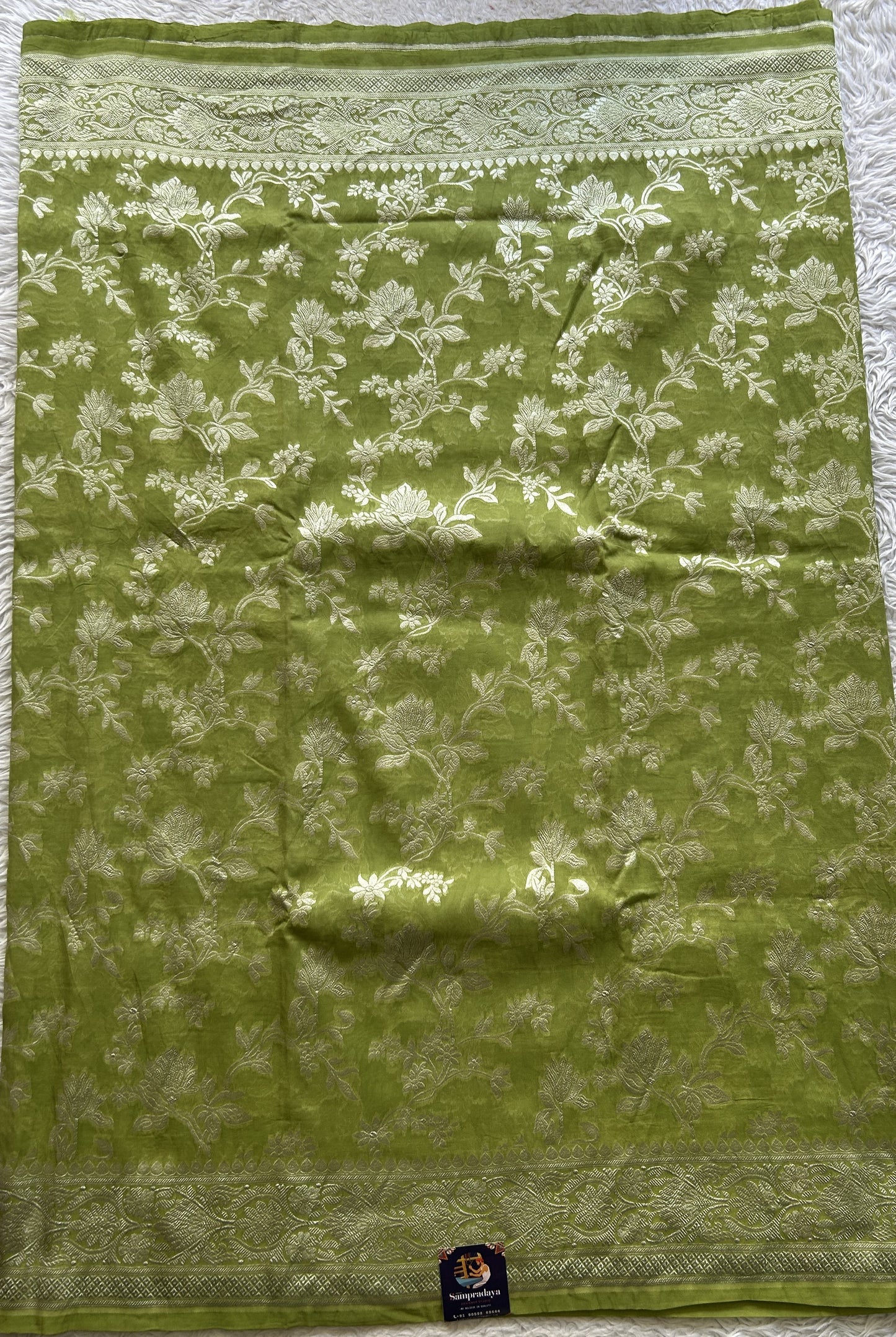 Banarasi Georgette Saree Parrot Green Colored Complemented with a Zari border. - Sampradaya Designer Studio