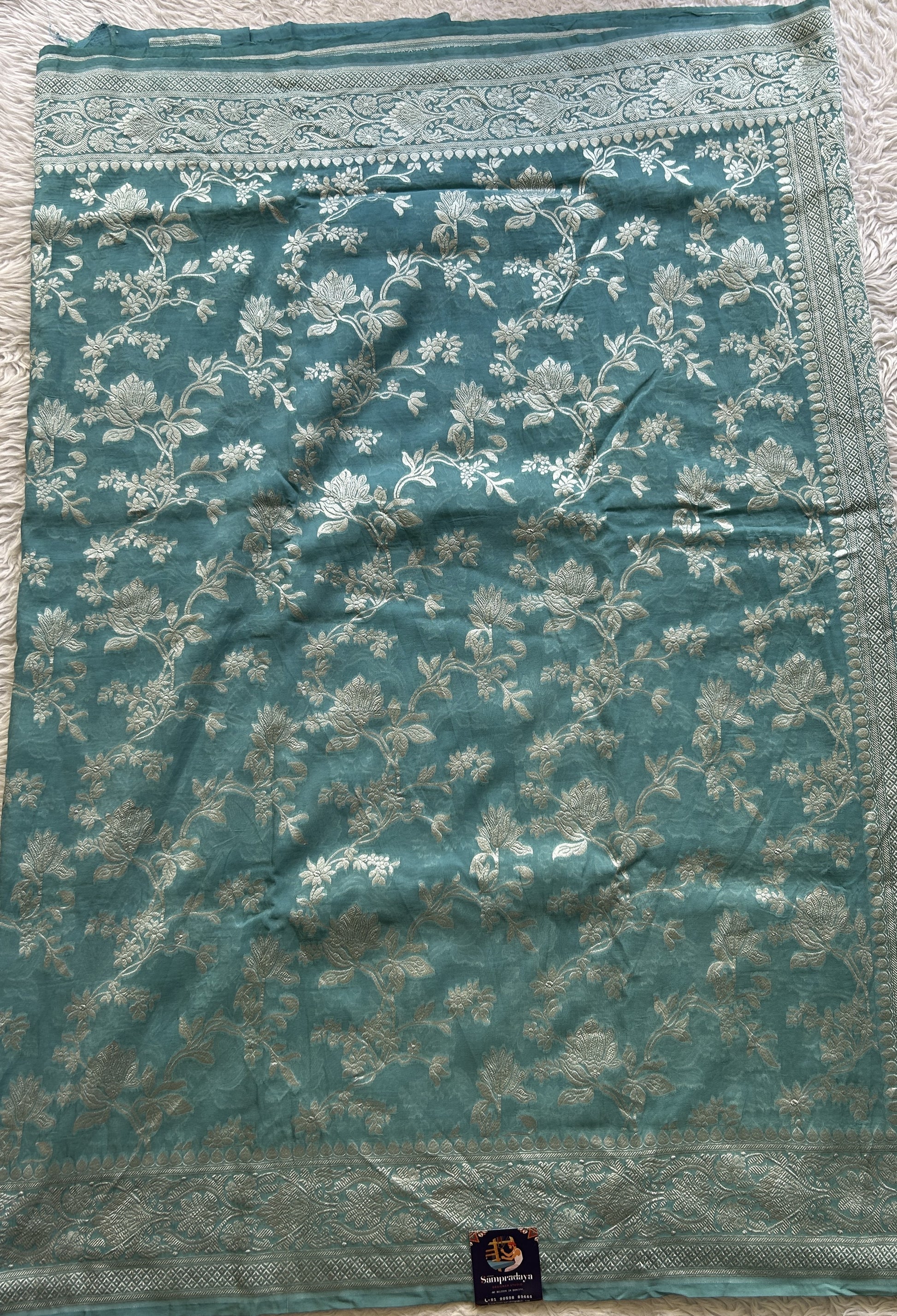 Banarasi Georgette Saree Light Blue Colored Complemented with a Zari border. - Sampradaya Designer Studio