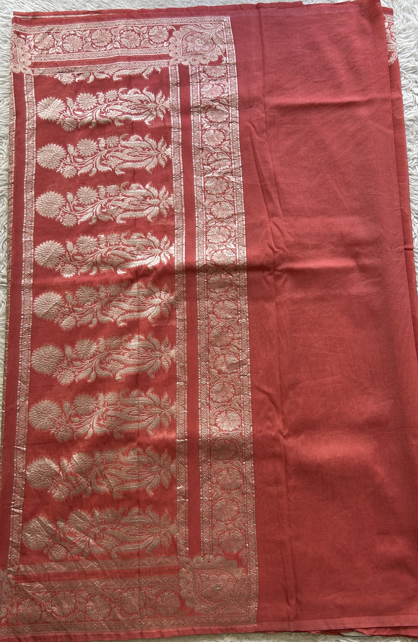Banarasi Georgette Saree Peach Colored Complemented with a Zari border. - Sampradaya Designer Studio