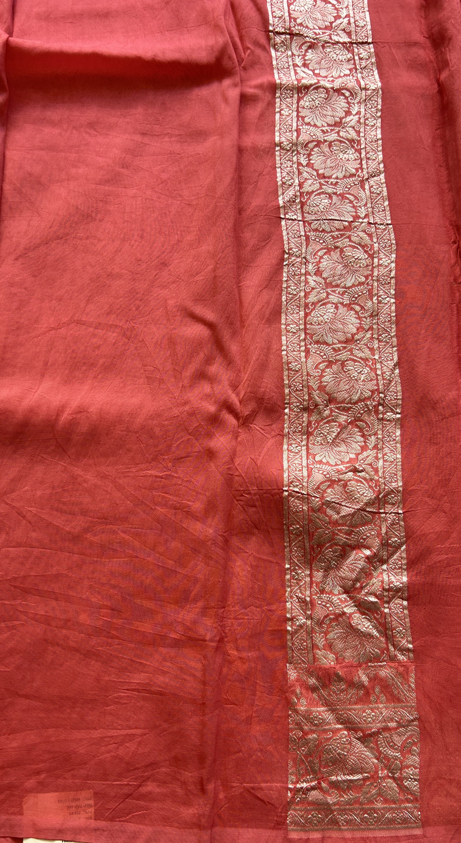 Banarasi Georgette Saree Peach Colored Complemented with a Zari border. - Sampradaya Designer Studio