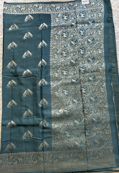 Banarasi Georgette Saree Teal Blue Colored Complemented with a Zari border. - Sampradaya Designer Studio