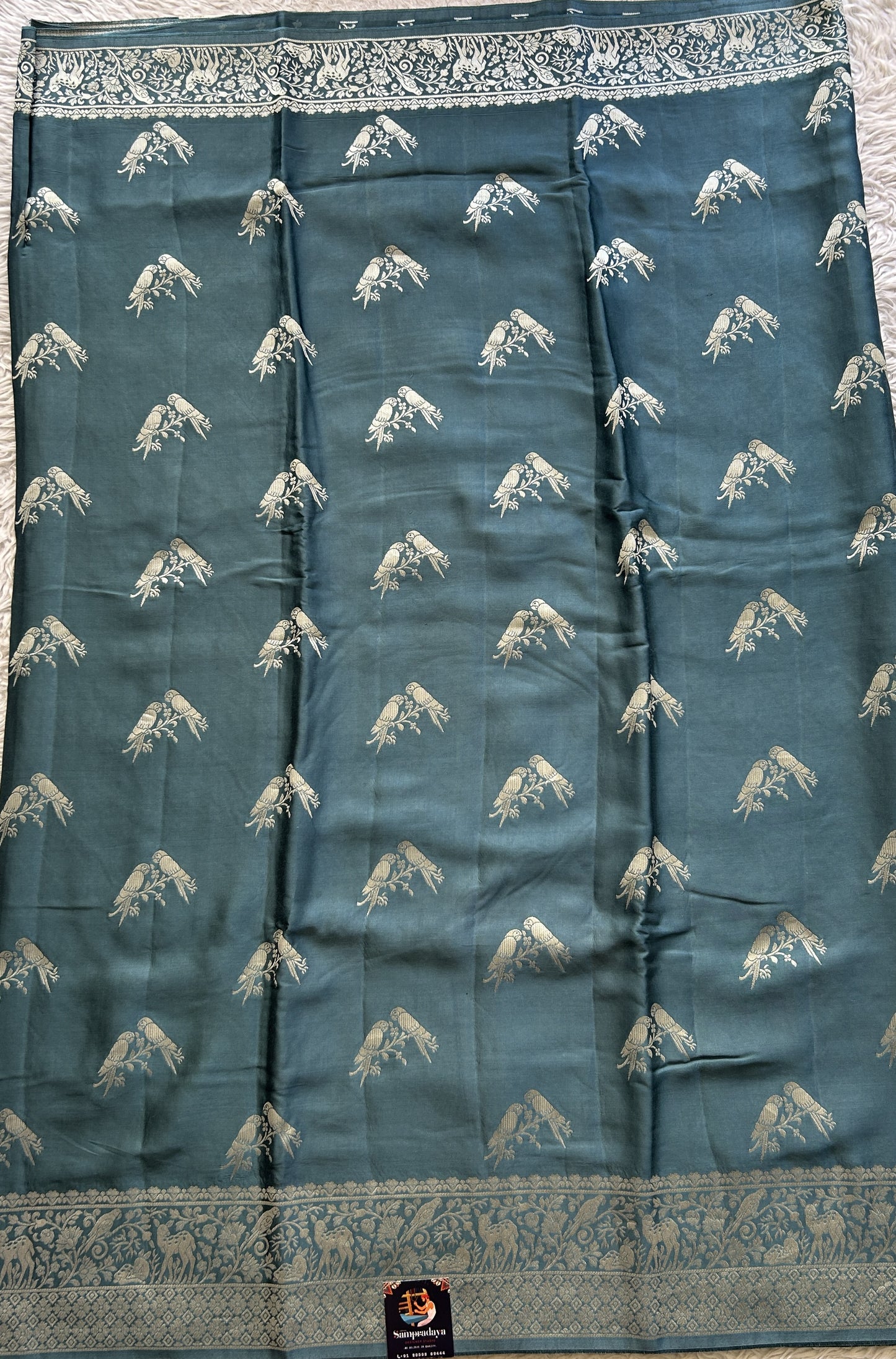 Banarasi Georgette Saree Teal Blue Colored Complemented with a Zari border. - Sampradaya Designer Studio