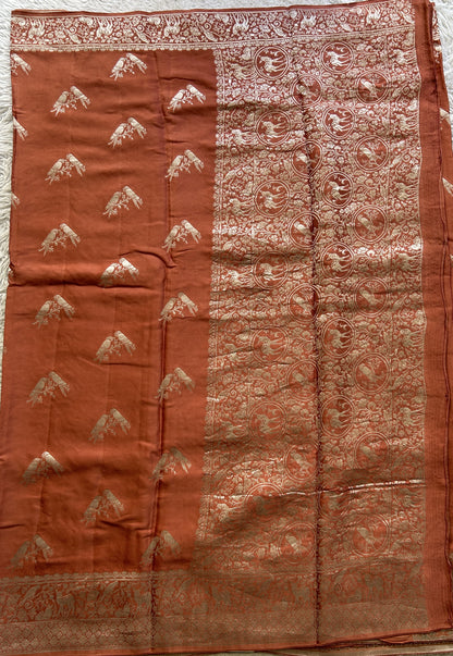 Banarasi Georgette Saree Peach Colored Complemented with a Zari border. - Sampradaya Designer Studio