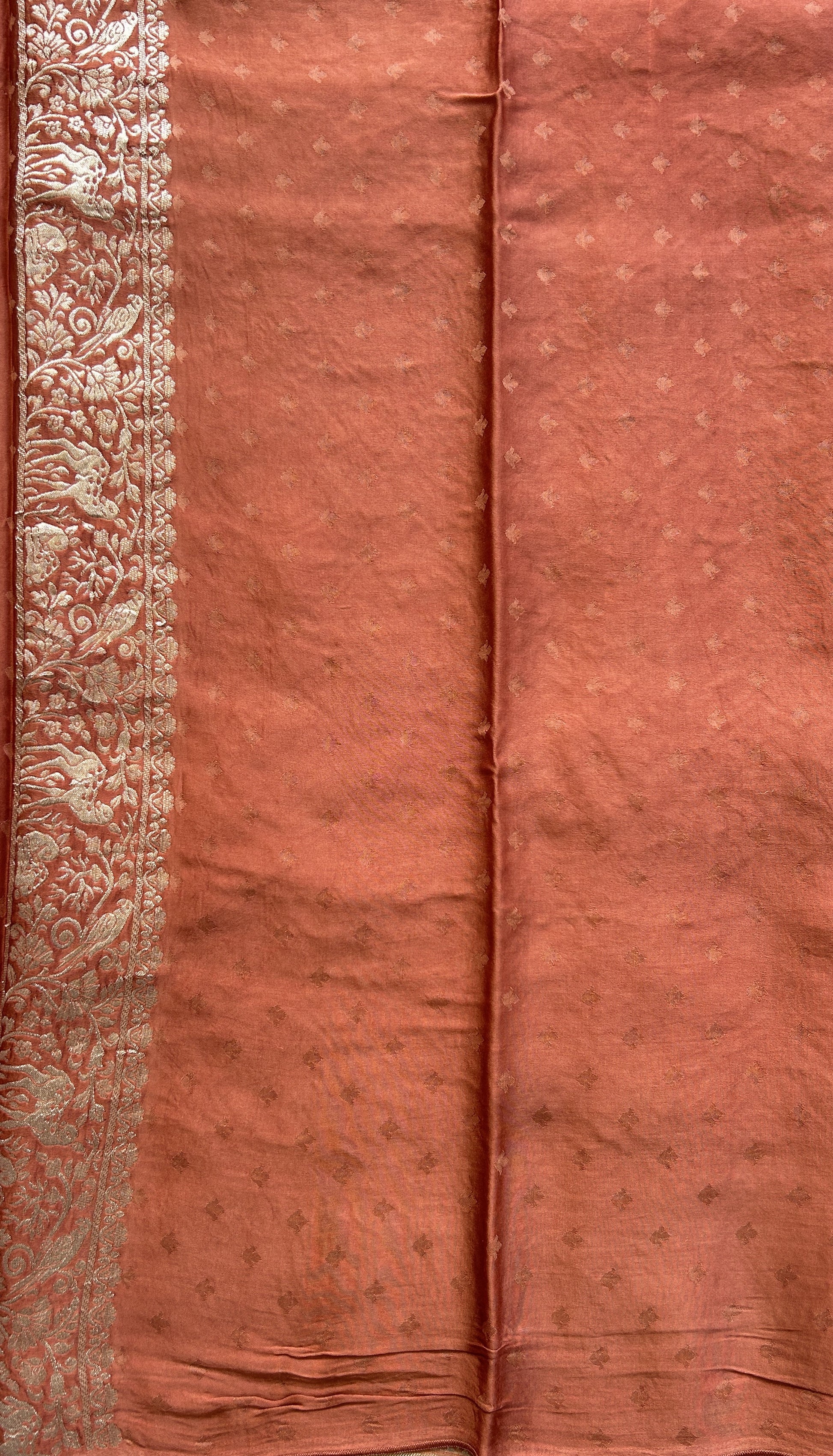 Banarasi Georgette Saree Peach Colored Complemented with a Zari border. - Sampradaya Designer Studio