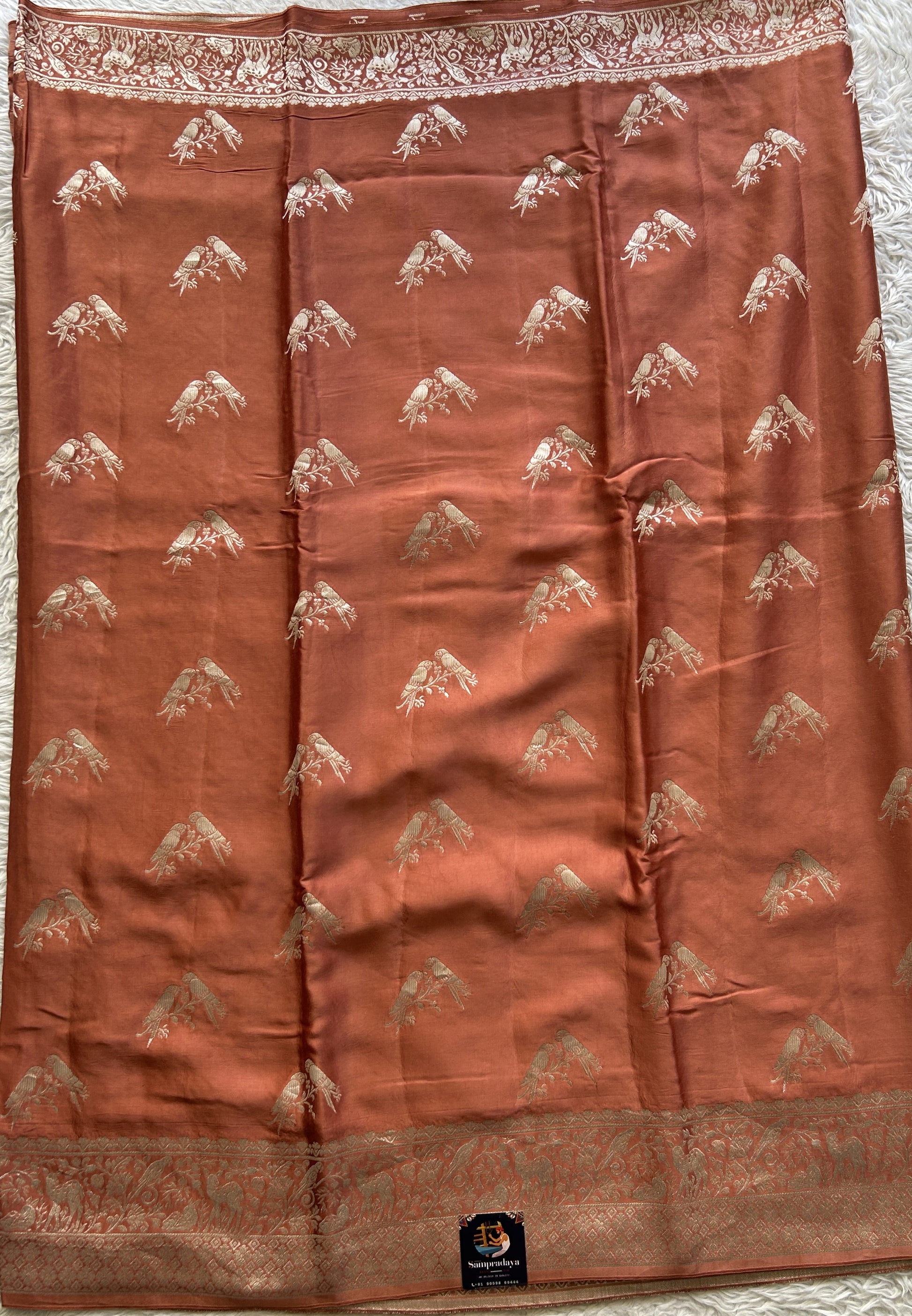Banarasi Georgette Saree Peach Colored Complemented with a Zari border. - Sampradaya Designer Studio