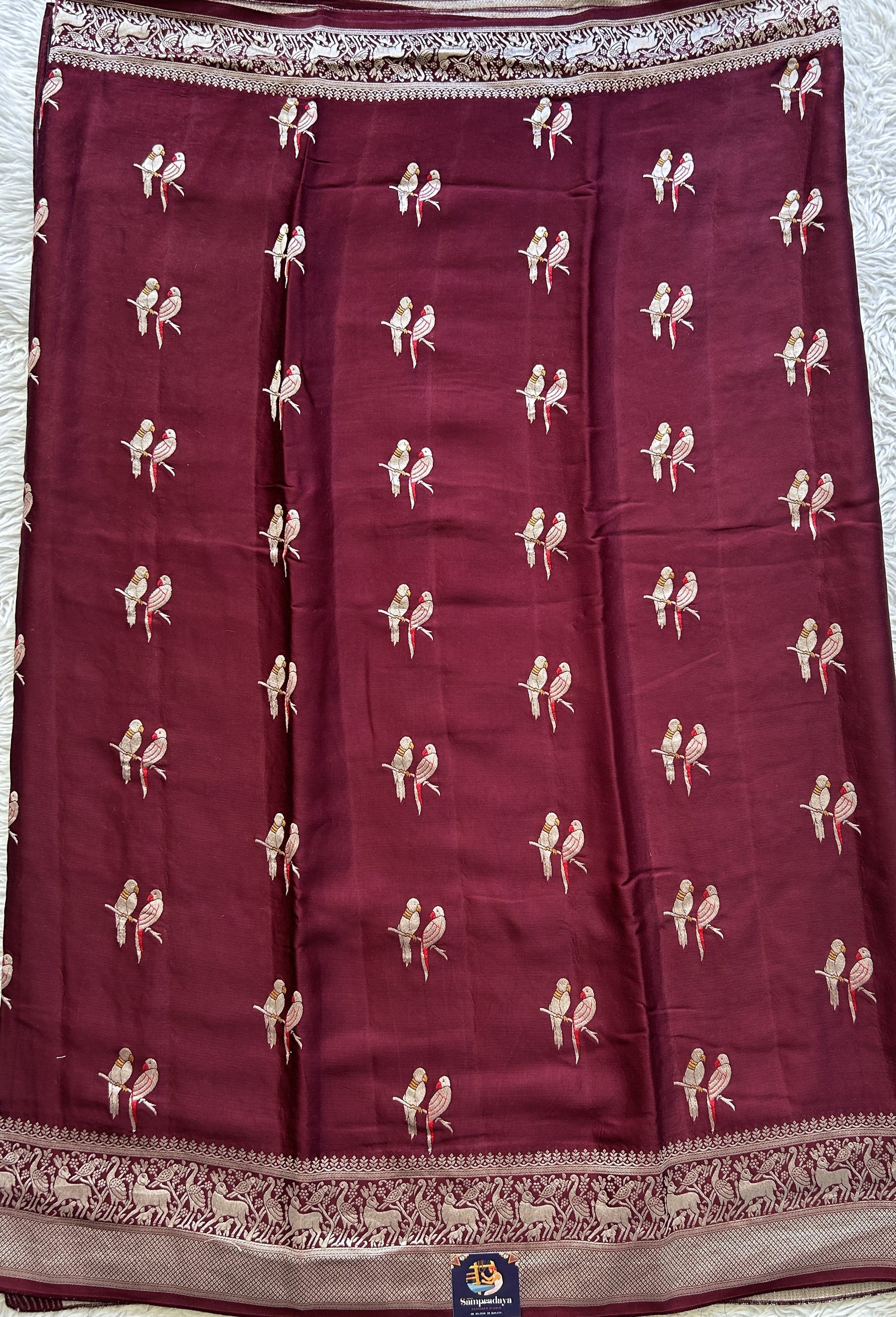 Banarasi Georgette Saree Wine Colored Complemented with a Zari border. - Sampradaya Designer Studio