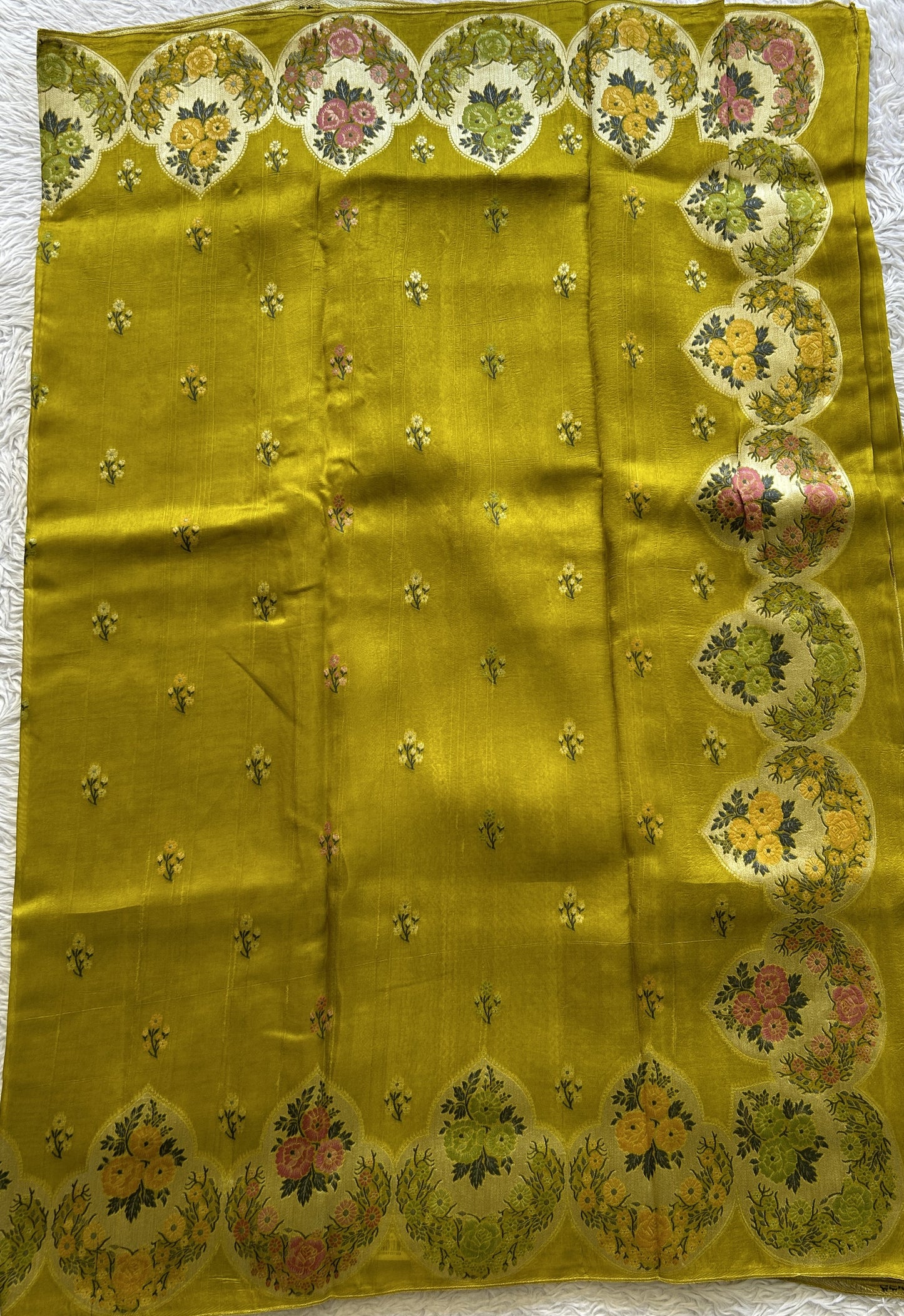Banarasi Tussar Georgette Saree Pear Colored Complemented with a Minakari border. - Sampradaya Designer Studio