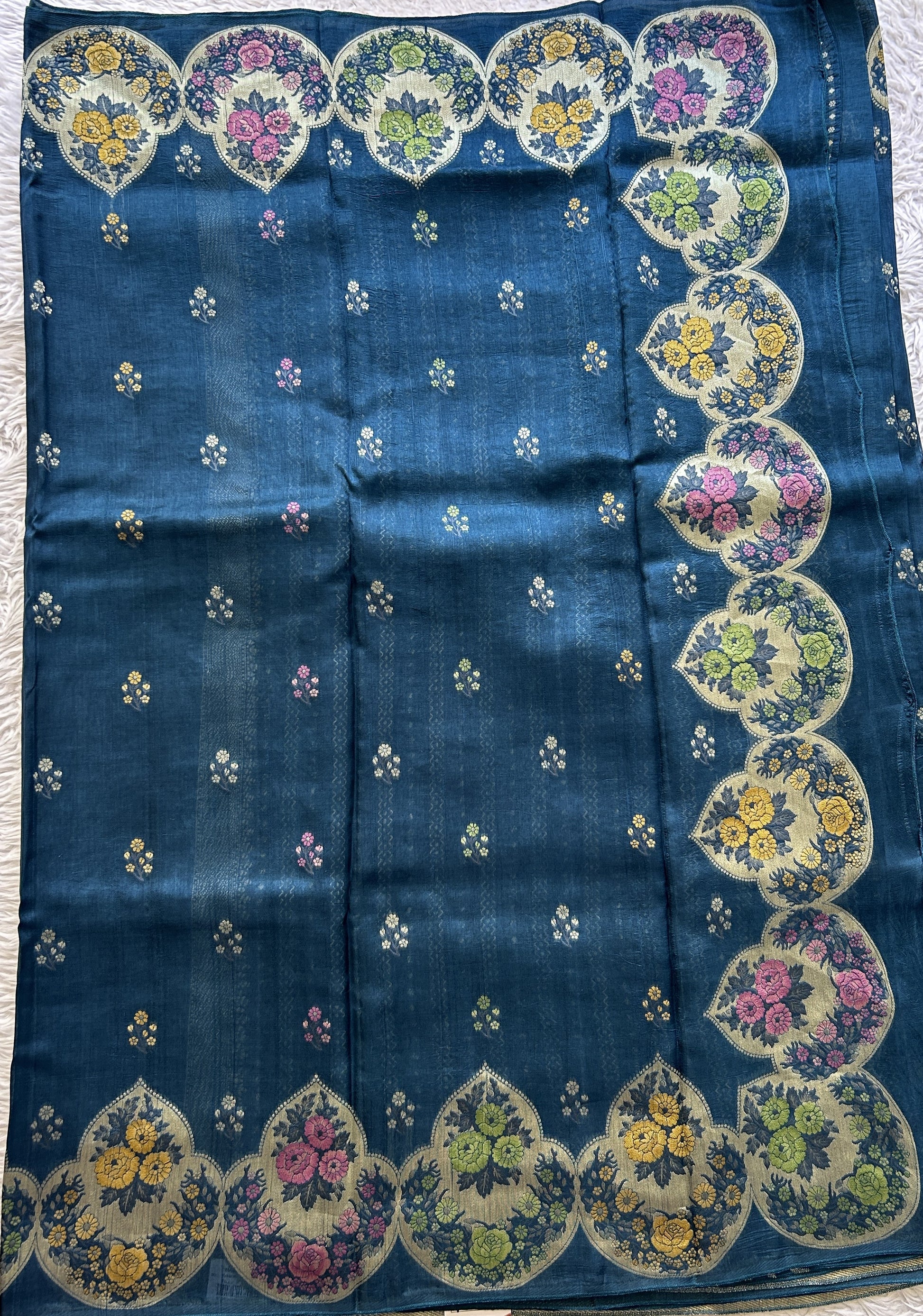 Banarasi Tussar Georgette Saree Peacock Blue Colored Complemented with a Minakari border. - Sampradaya Designer Studio