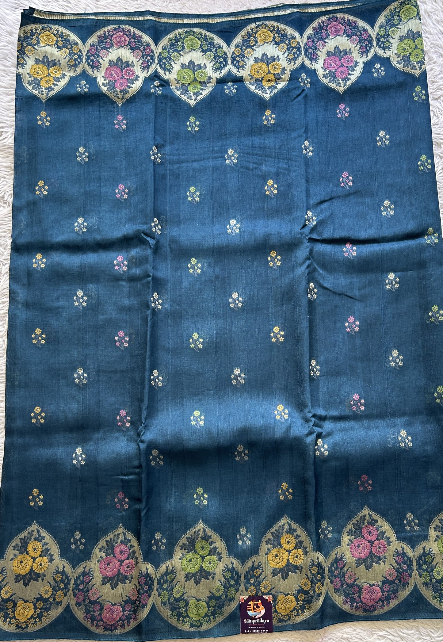Banarasi Tussar Georgette Saree Peacock Blue Colored Complemented with a Minakari border. - Sampradaya Designer Studio