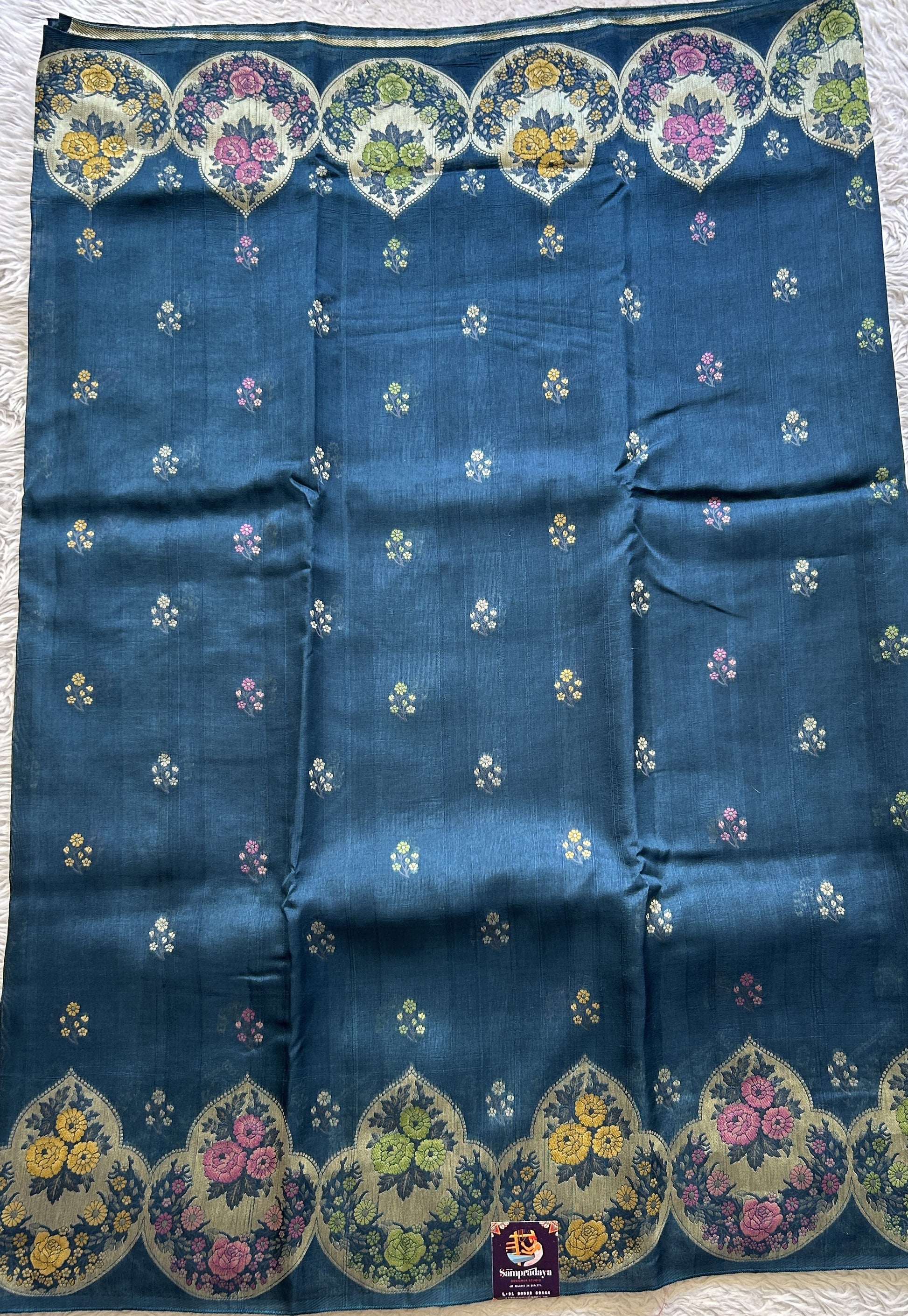 Banarasi Tussar Georgette Saree Peacock Blue Colored Complemented with a Minakari border. - Sampradaya Designer Studio