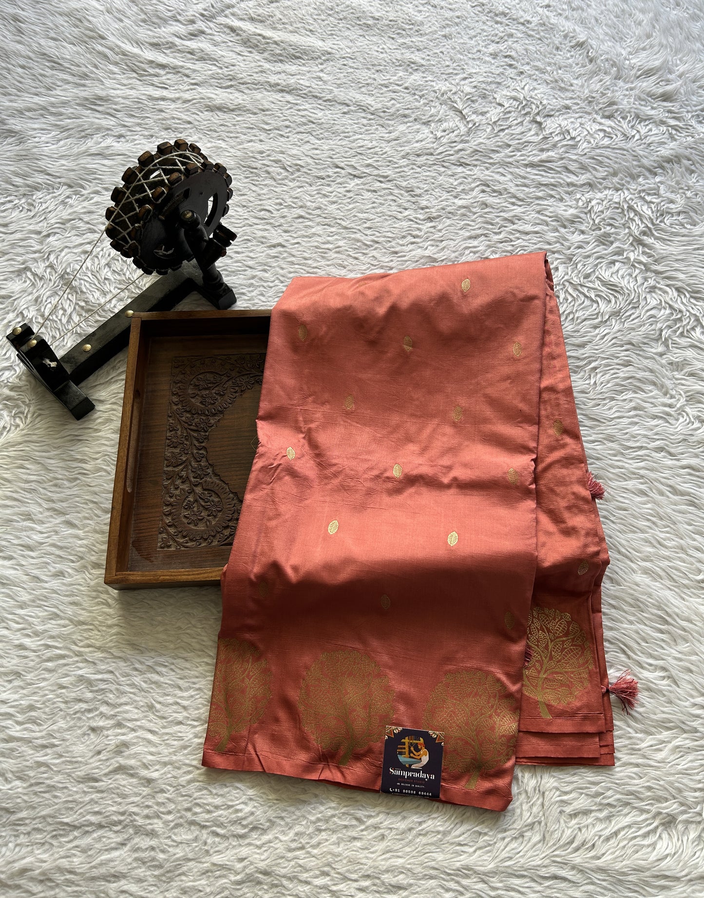 Mona Silk Saree Peach Colored Paired with a Buti Border. - Sampradaya Designer Studio