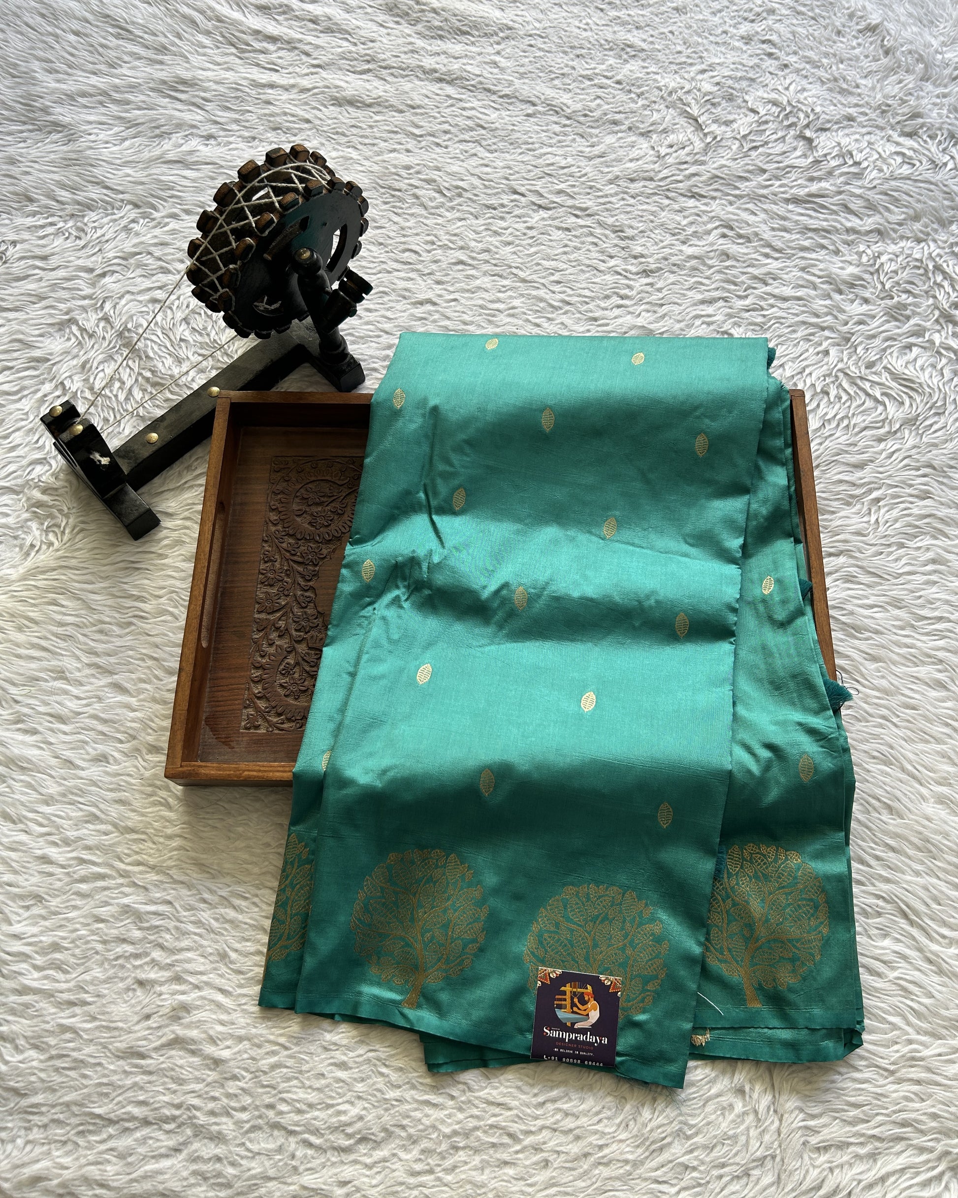 Mona Silk Saree Turquoise Green Colored Paired with a Buti Border. - Sampradaya Designer Studio