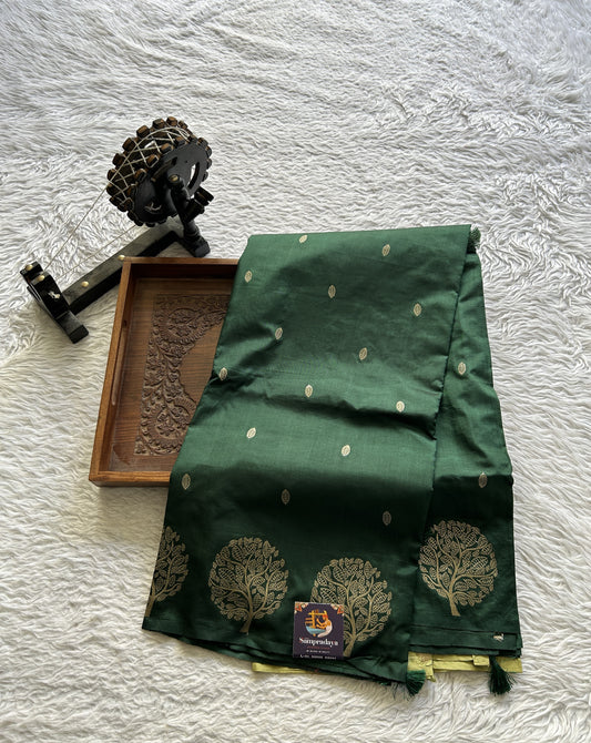 Mona Silk Saree Dark Green Colored Paired with a Buti Border. - Sampradaya Designer Studio