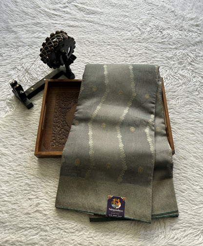Semi Georgette Saree Fossil Colored Elegantly Paired with a Zari Border. - Sampradaya Designer Studio