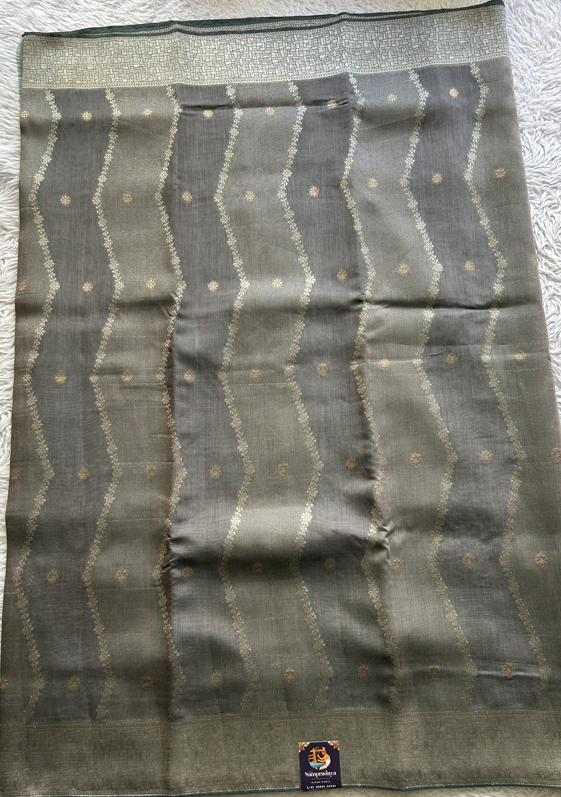 Semi Georgette Saree Fossil Colored Elegantly Paired with a Zari Border. - Sampradaya Designer Studio