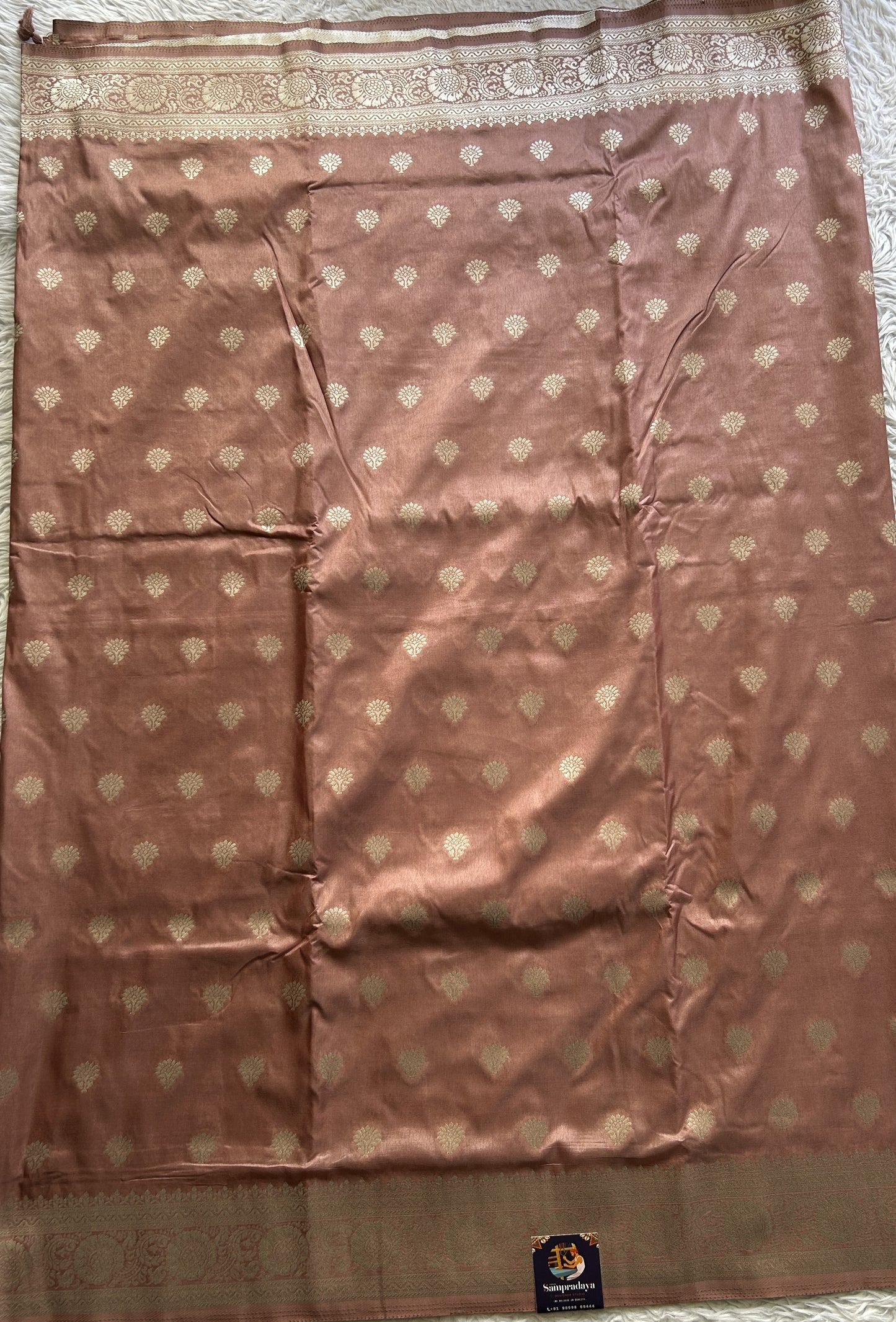 Semi Georgette Saree Light Peach Colored Elegantly Paired with a Zari Border. - Sampradaya Designer Studio