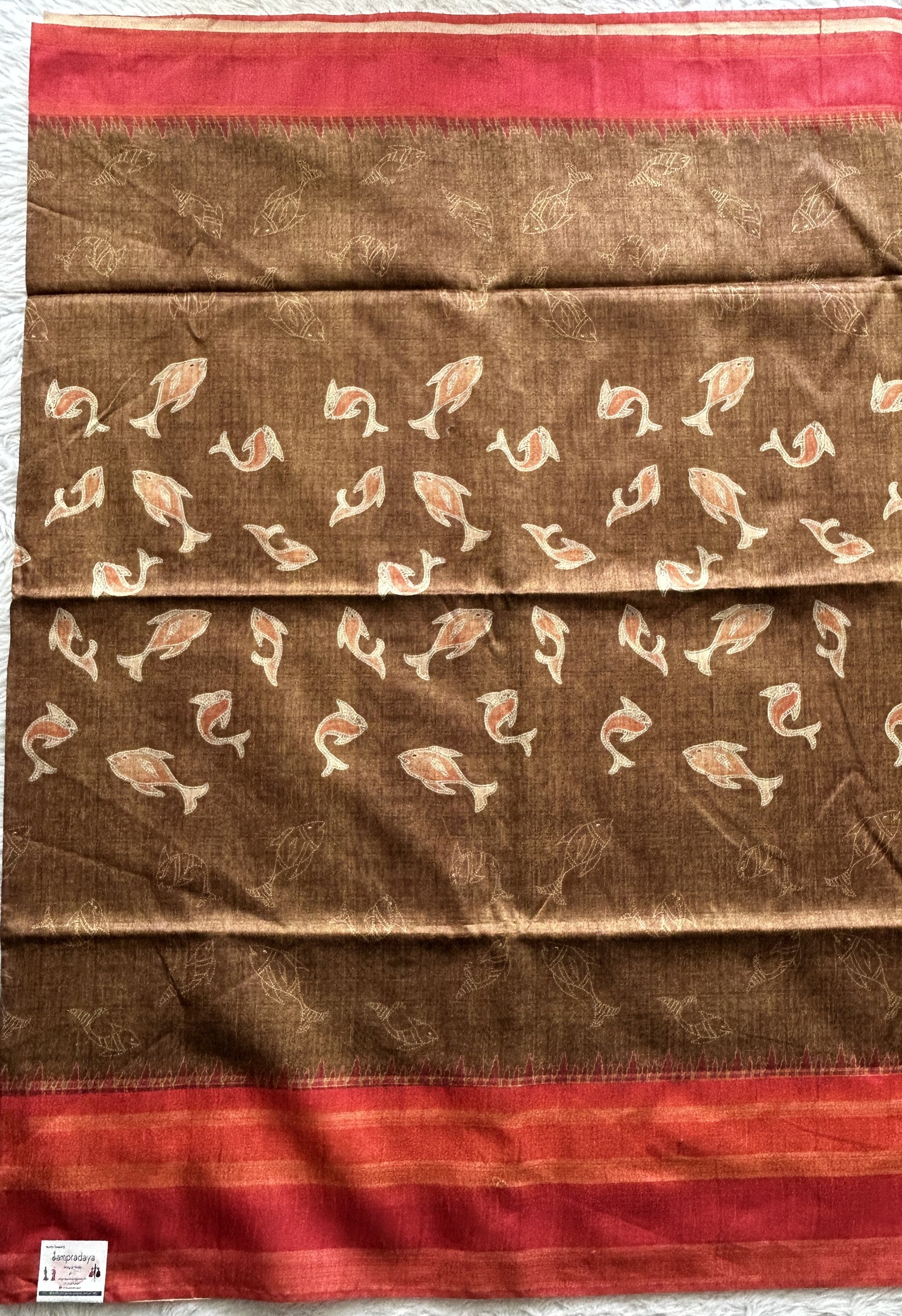 Semi Tussar Saree Brown colored complemented with a Red Color Zari Border. - Sampradaya Designer Studio