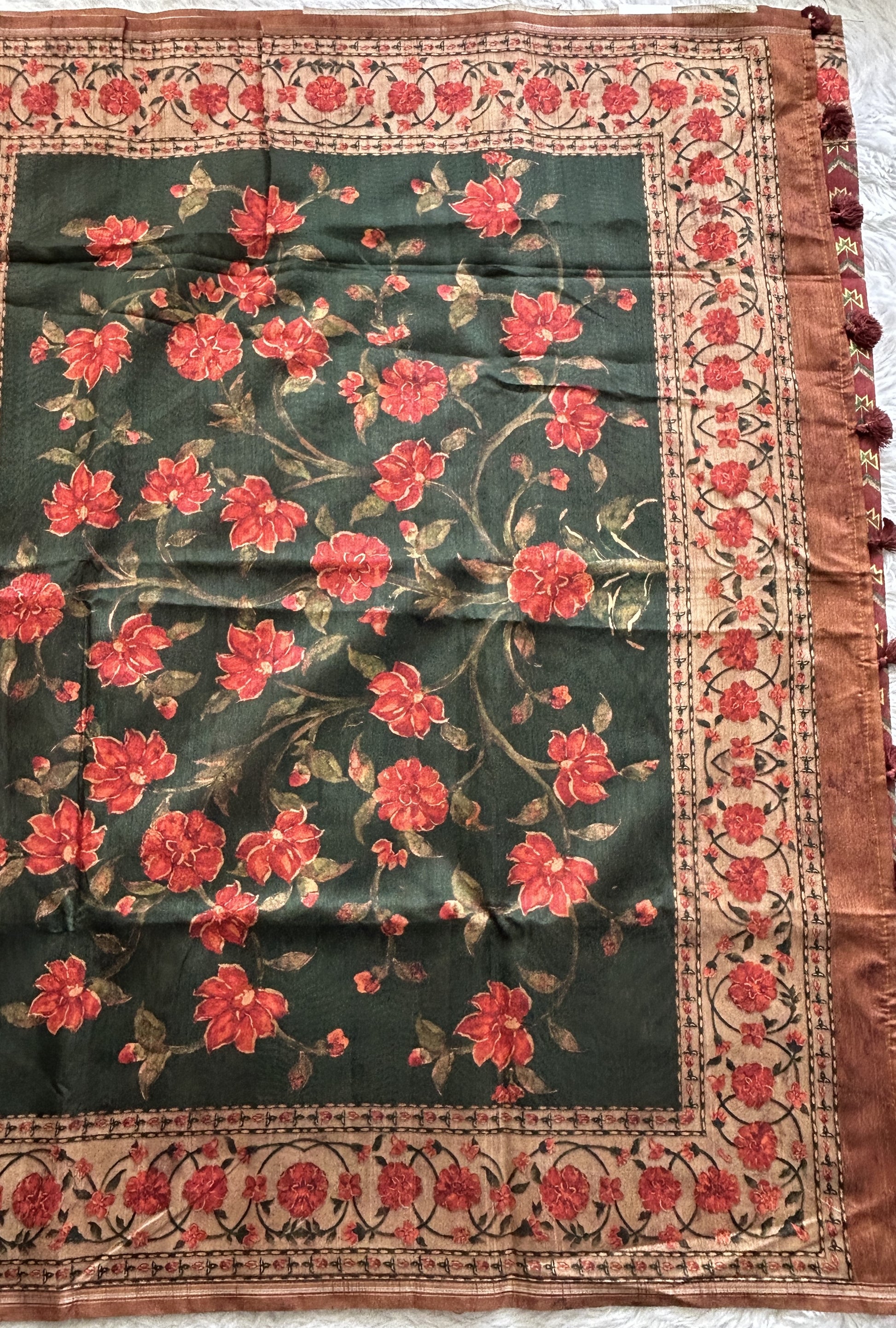 Semi Tussar Saree Bottle Green Colored complemented with a Floral Print Border. - Sampradaya Designer Studio